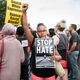 A woman raises her fist at the front of a march down Washington Avenue in Minneapolis on Aug. 14, 2017, to protest racism and the violence in Charlottesville, Va. (Stephen Maturen/Getty Images)
